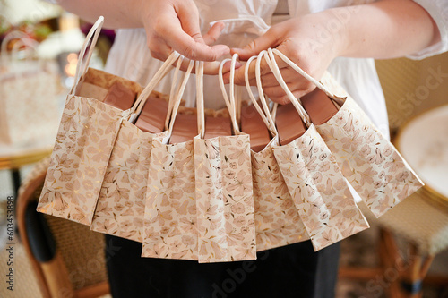 Photography a close up of a person holding a paper bag