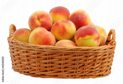 Basket full of fresh peaches isolated on white background