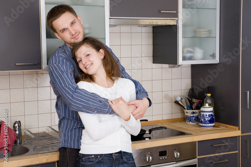 happy couple together in kitchen