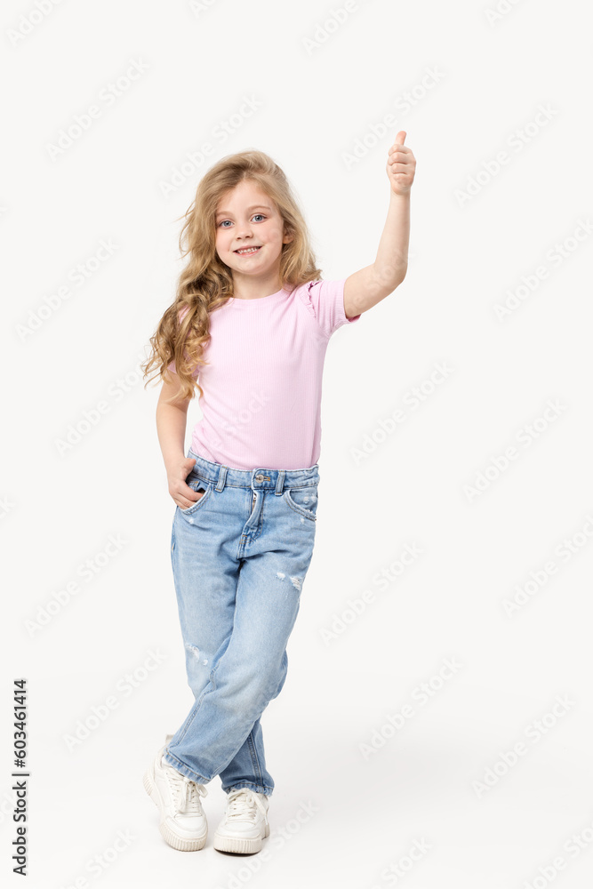 Portrait of a cute baby girl on a white background, holding her hands near her face. Big blue eyes and wavy hair. Blank space for inscription Portrait of a cute baby girl on a white background, holding her hands near her face. Big blue eyes and wavy hair. Blank space for inscription