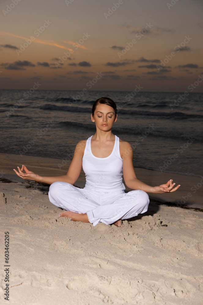 Young beautiful woman during fitness on sea beach Young beautiful woman during fitness on sea beach