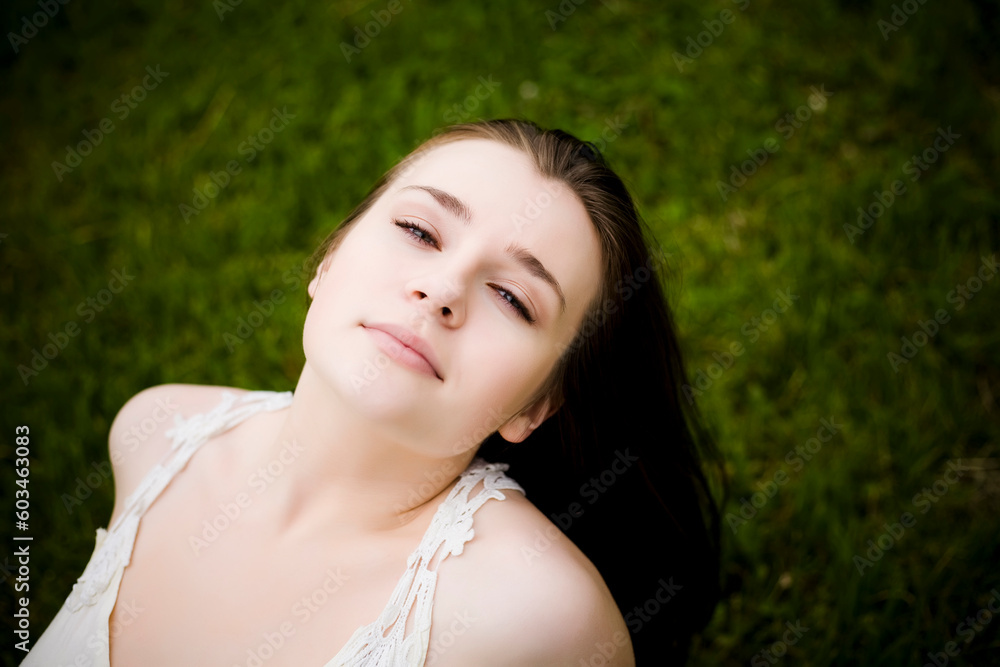 Relaxing Woman On The Grass