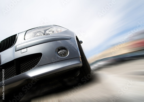 Fast generic car with no logo moving with motion blur