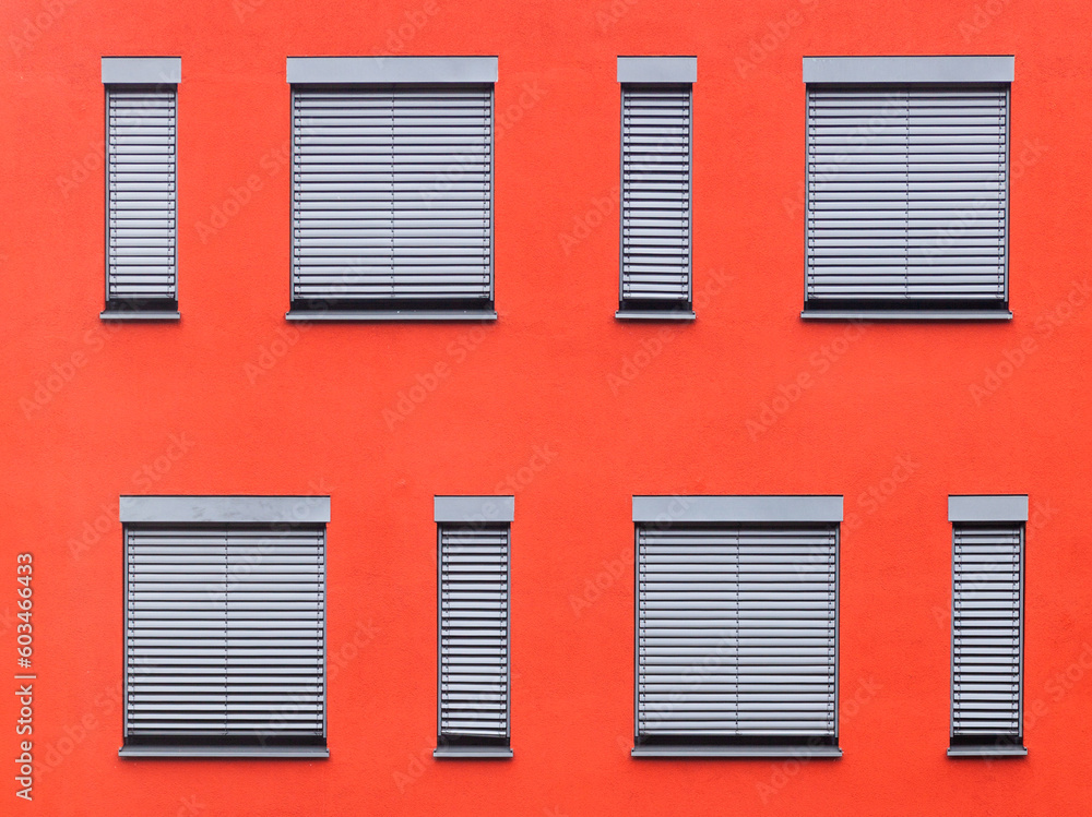 Fototapeta premium pattern of windows with red wall