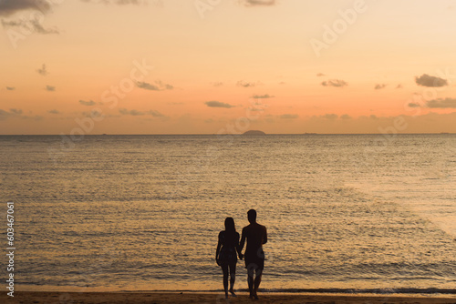 Couple silhouette background sea sunset