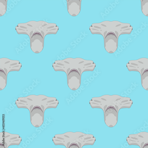 Seamless animal pattern with heads of hammerhead shark. On blue background. photo