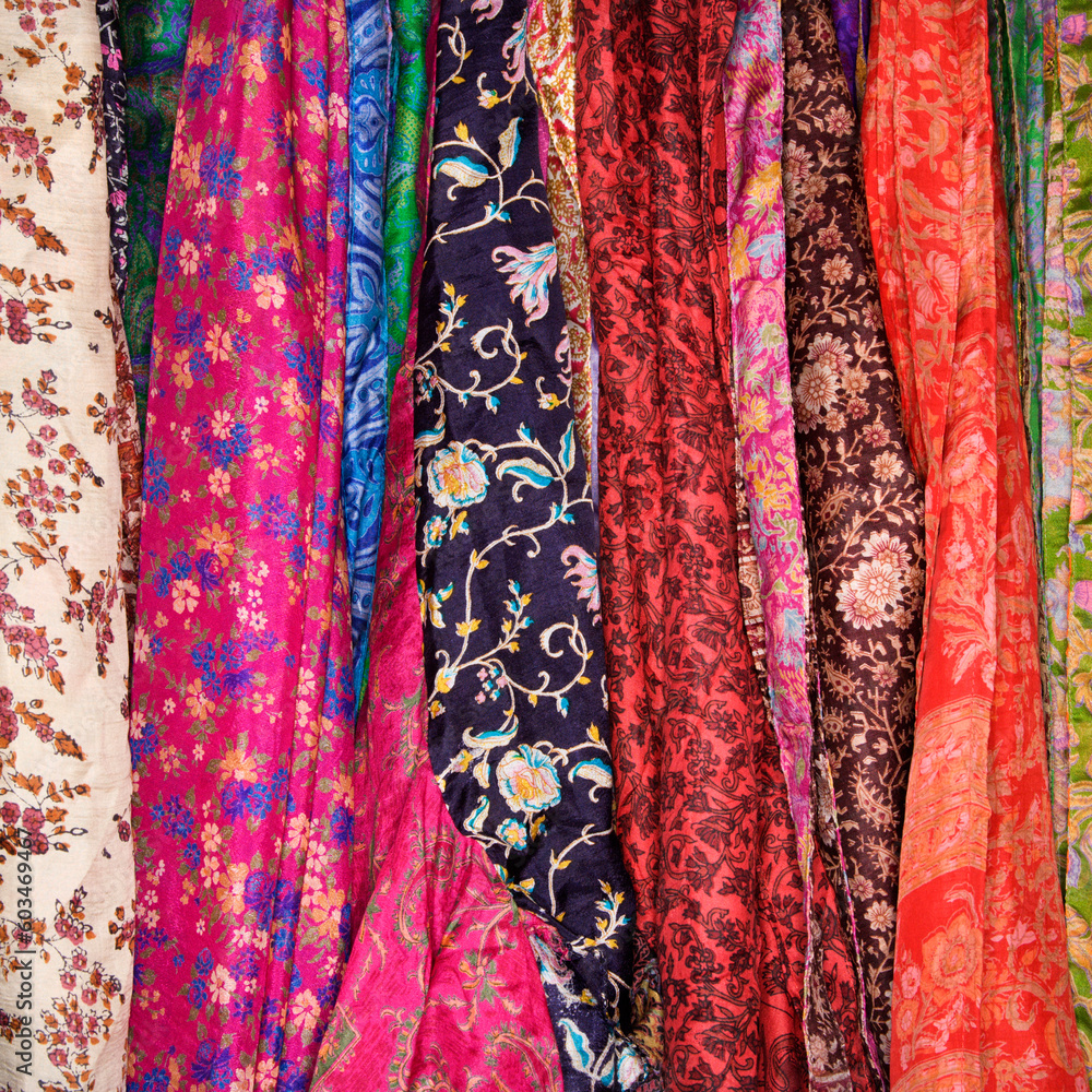 Colorful Mexican patterned fabric hanging on a rack. Square shot. Colorful Mexican patterned fabric hanging on a rack. Square shot.