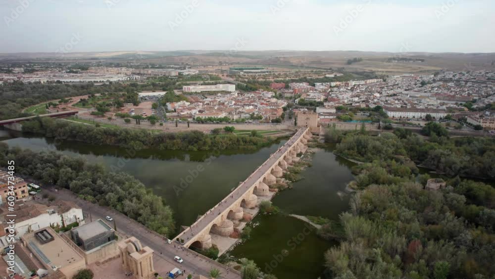 Roman Bridge on Guadalquivir river at dusk in the city of Cordoba, Andalusia. Roman Bridge on Guadalquivir river at dusk in the city of Cordoba, Andalusia.