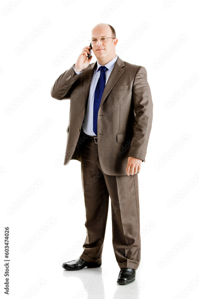 Middle-aged businessman making a phone call, isolated on white background Middle-aged businessman making a phone call, isolated on white background