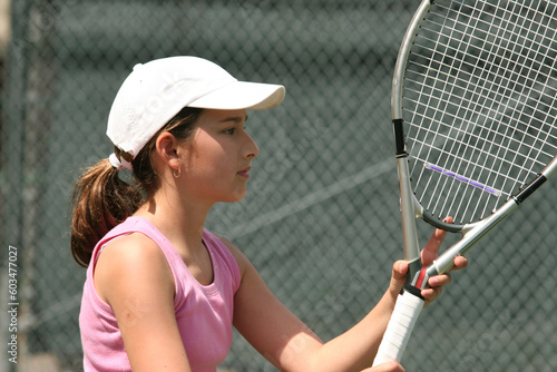 Teenage girl playing tennis © Designpics
