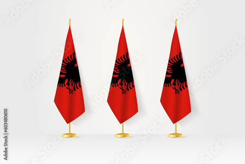 Three Albania flags in a row on a golden stand, illustration of press conference and other meetings.