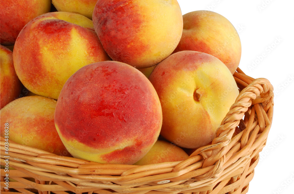 Basket full of fresh peaches isolated on white background Basket full of fresh peaches isolated on white background