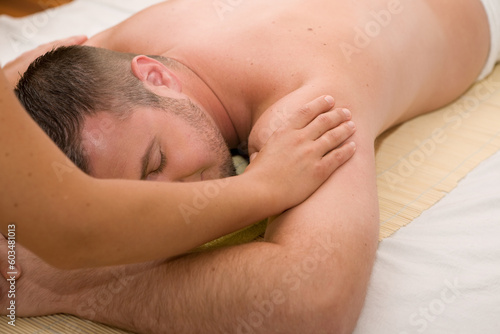 happy man relaxing in spa salon