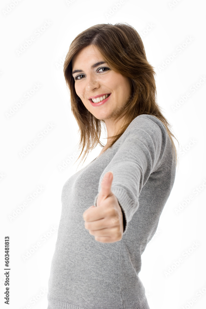 Portrait of an attractive young woman with thumbs up. - Isolated on white Portrait of an attractive young woman with thumbs up. - Isolated on white