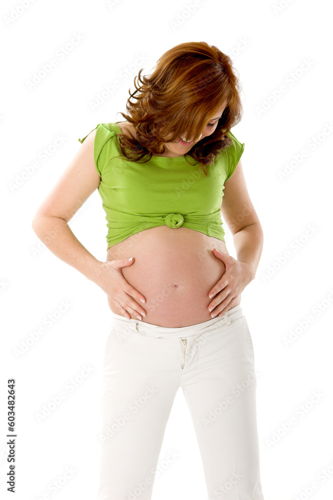 Beautiful pregnant woman on white enjoying this wonderful moment Beautiful pregnant woman on white enjoying this wonderful moment