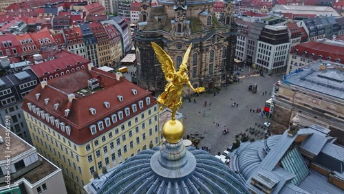 Drone shot of golden statue on the Kunsthalle in Lipsius building, known and crowned as the art academy, on the Brühlsche Terrasse,  . Dresden , Germany