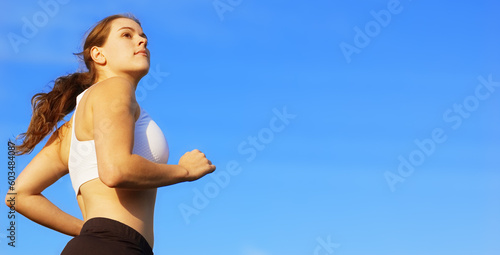 Beautiful young woman runner having a workout session.