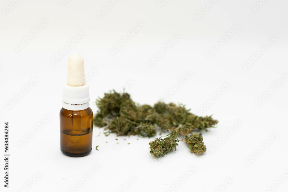 Jar with CBD oil and marijuana flowers Jar with CBD oil and marijuana flowers