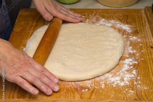 Rolling Out Dough For Pizza.