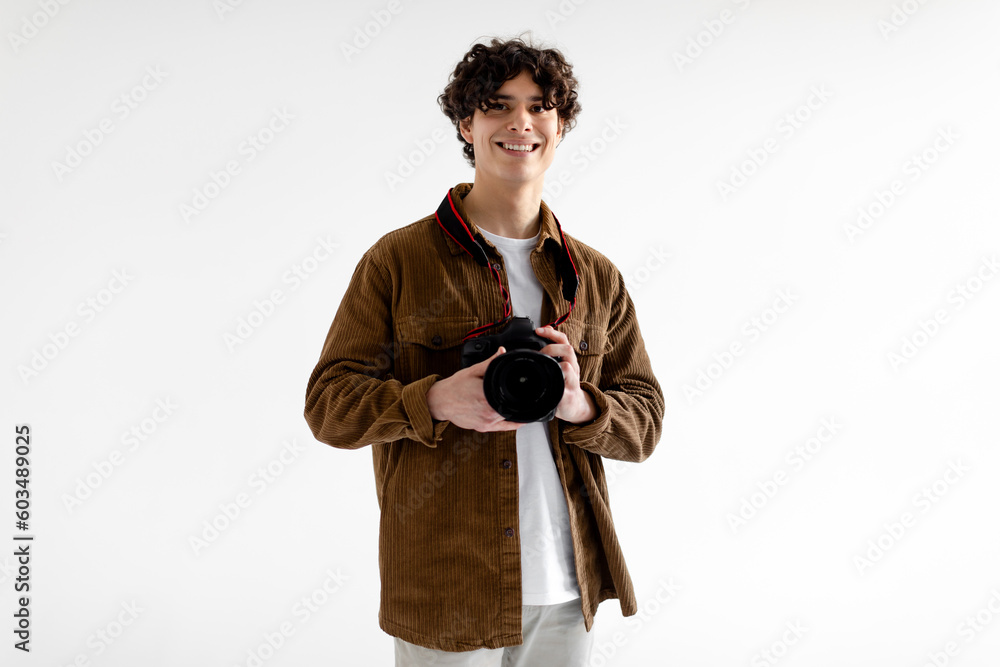 Professional creative photography career concept. Happy handsome photographer man posing holding photo camera - obrazy, fototapety, plakaty 