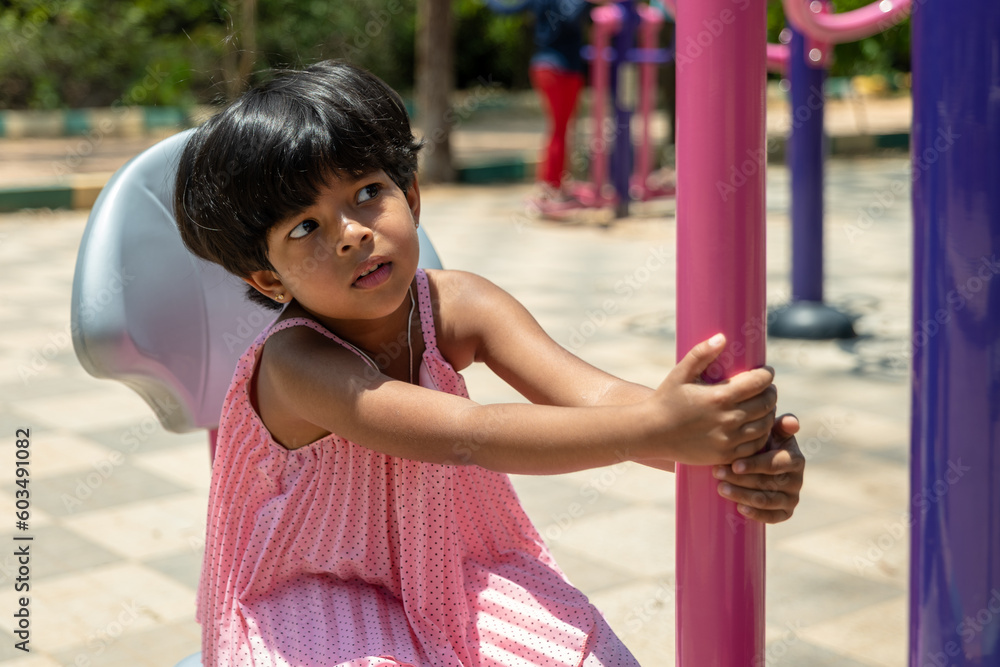 Little Girl's Playtime in the Children's Park Little Girl's Playtime in the Children's Park