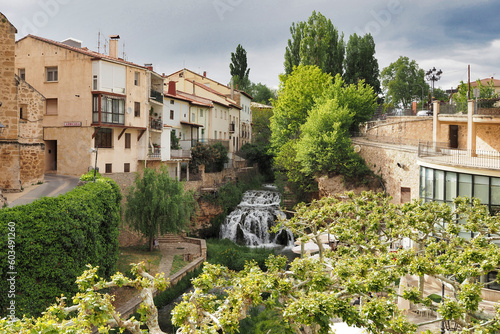 waterfall of the cifuentes river as it passes through the town of trillo