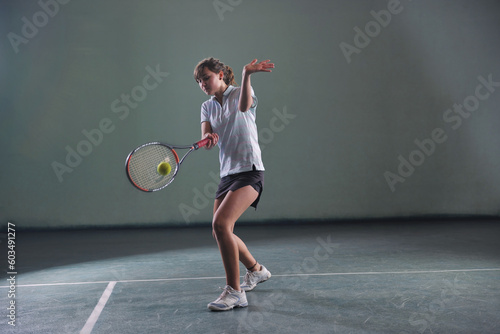 young girl exercise tennis sport indoor © Designpics