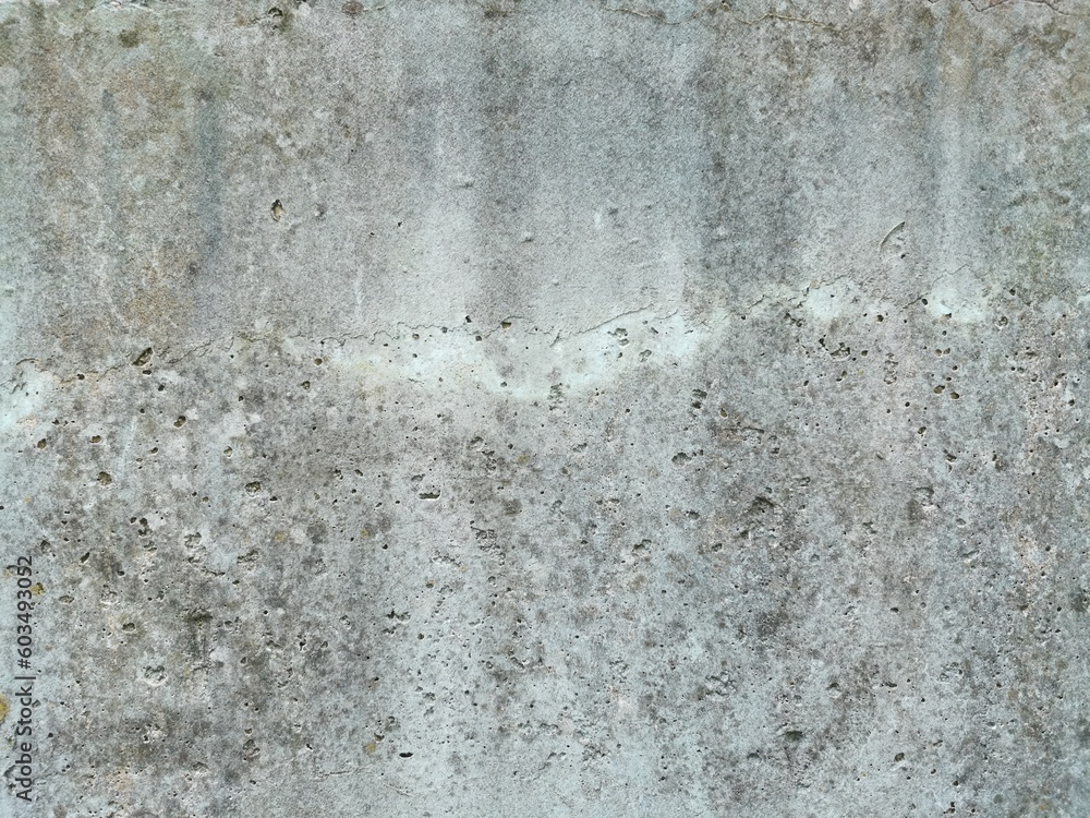 The grunge texture is an old gray concrete wall. The grunge texture is an old gray concrete wall.