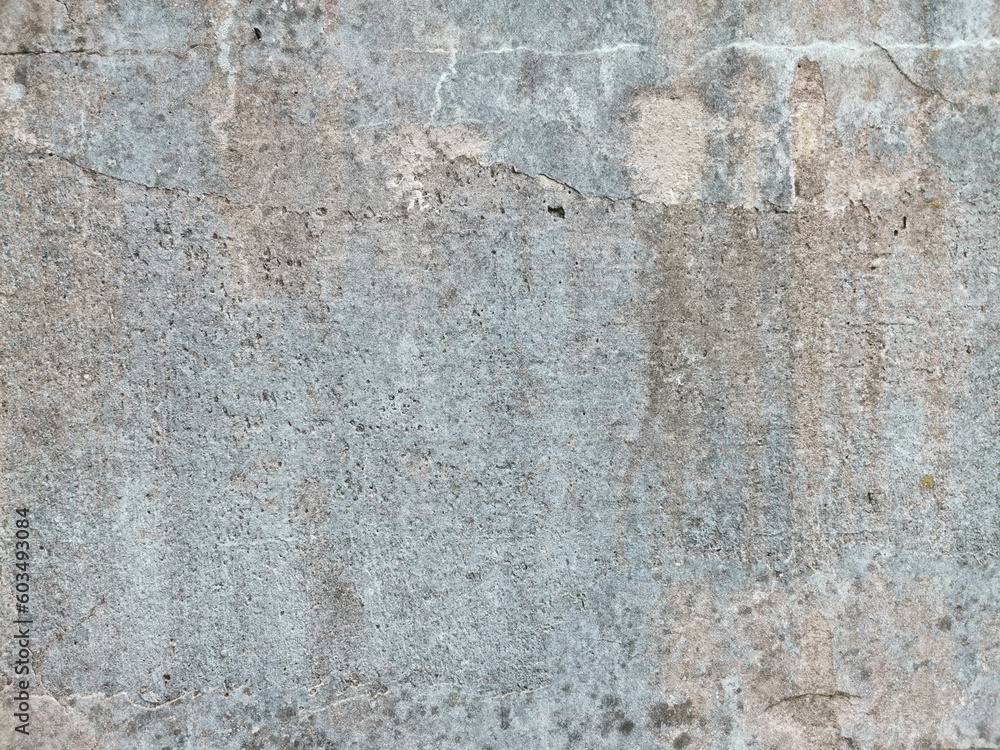 The grunge texture is an old gray concrete wall. The grunge texture is an old gray concrete wall.