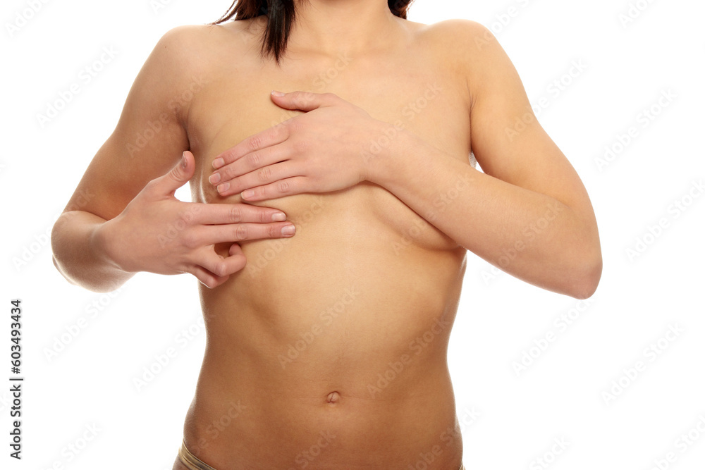 Fototapeta premium Breast cancer - Woman holding her breast
