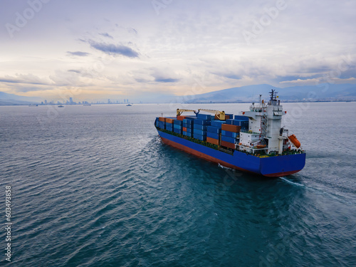 Aerial view container ship driving on the sea for logistic import export or transportation