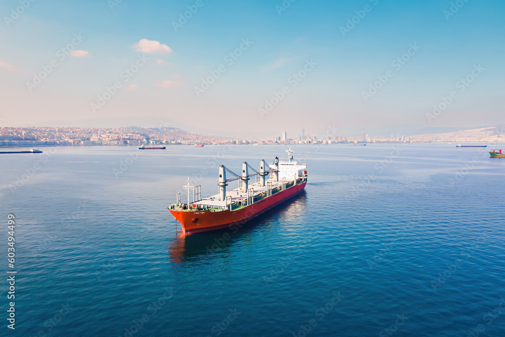 Cargo bulker ship waiting uploading stay at anchor near port. Aerial shot Cargo bulker ship waiting uploading stay at anchor near port. Aerial shot