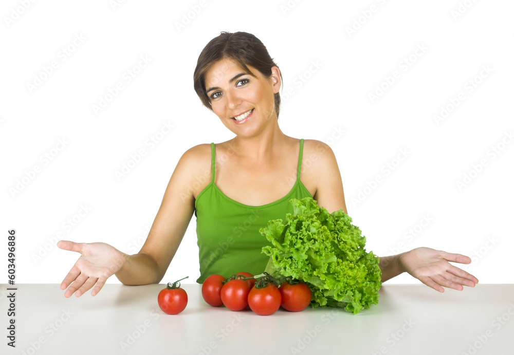 Beautiful young woman in the kitchen with healthy vegetables in front of her Beautiful young woman in the kitchen with healthy vegetables in front of her
