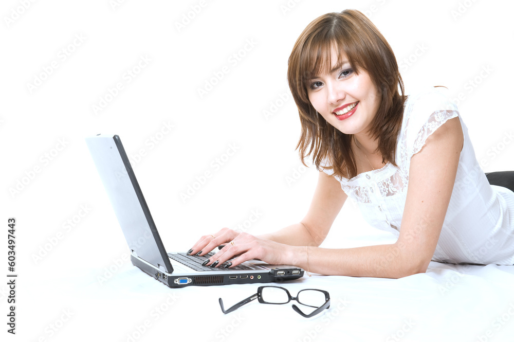 Young japanese businesswoman with laptop lying on the floor. Isolated Young japanese businesswoman with laptop lying on the floor. Isolated