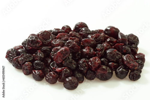 Dried cranberries on bright background