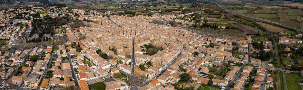 Aerial above the old town of Pézenas in France on a sunny day in early spring.