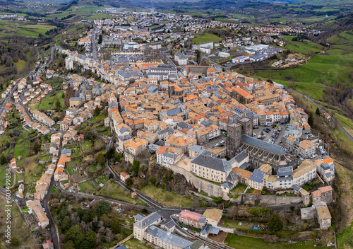 Aerial above the old town of Saint-Flour in France on a sunny day in early spring.