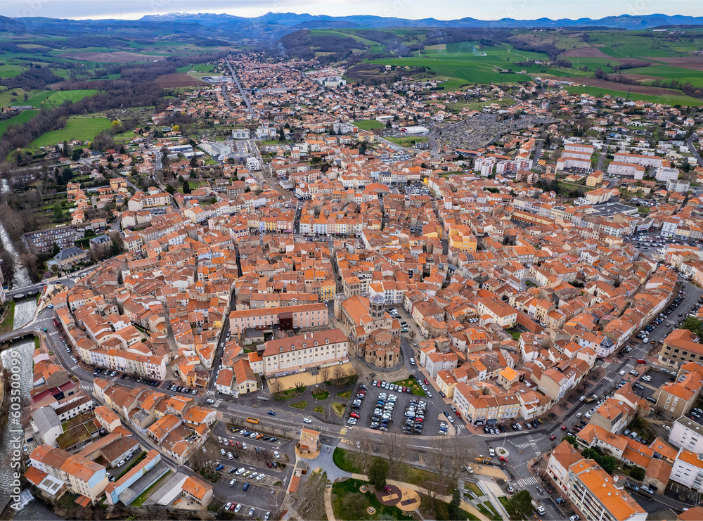 Aerial view around the old town of the city Issoire in France on a sunny day in early spring	
