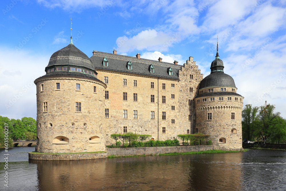 Fototapeta premium The beautiful Orebro Castle, whose construction began in the 14th century, is surrounded by water in the Swedish province of Narke.