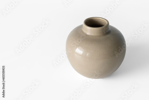 Ordinary cheap ceramic vase on a white background. Copy space