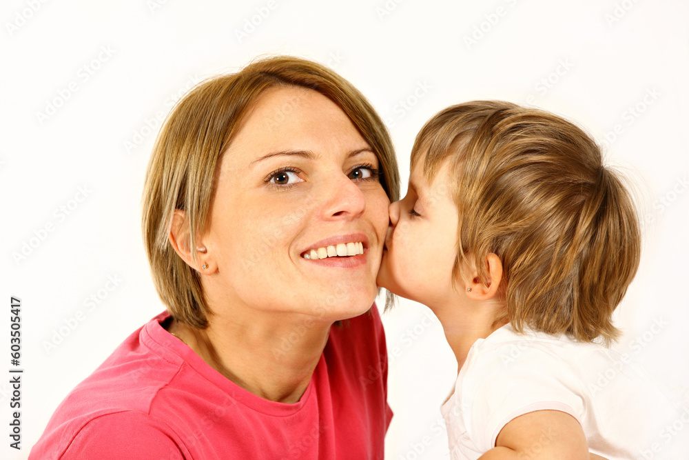 daughter is kissing her mother over white background daughter is kissing her mother over white background