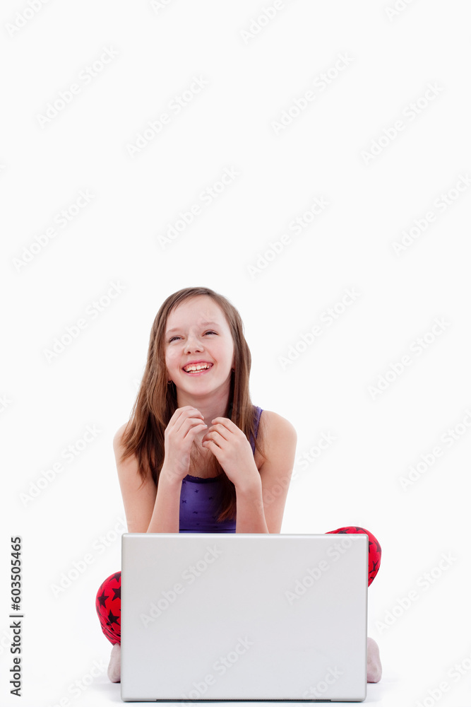 young girl with laptop computer smiling - isolated on white young girl with laptop computer smiling - isolated on white