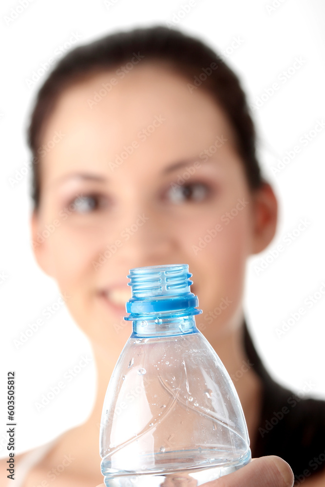 Young woman drinking water from plactic bottle Young woman drinking water from plactic bottle