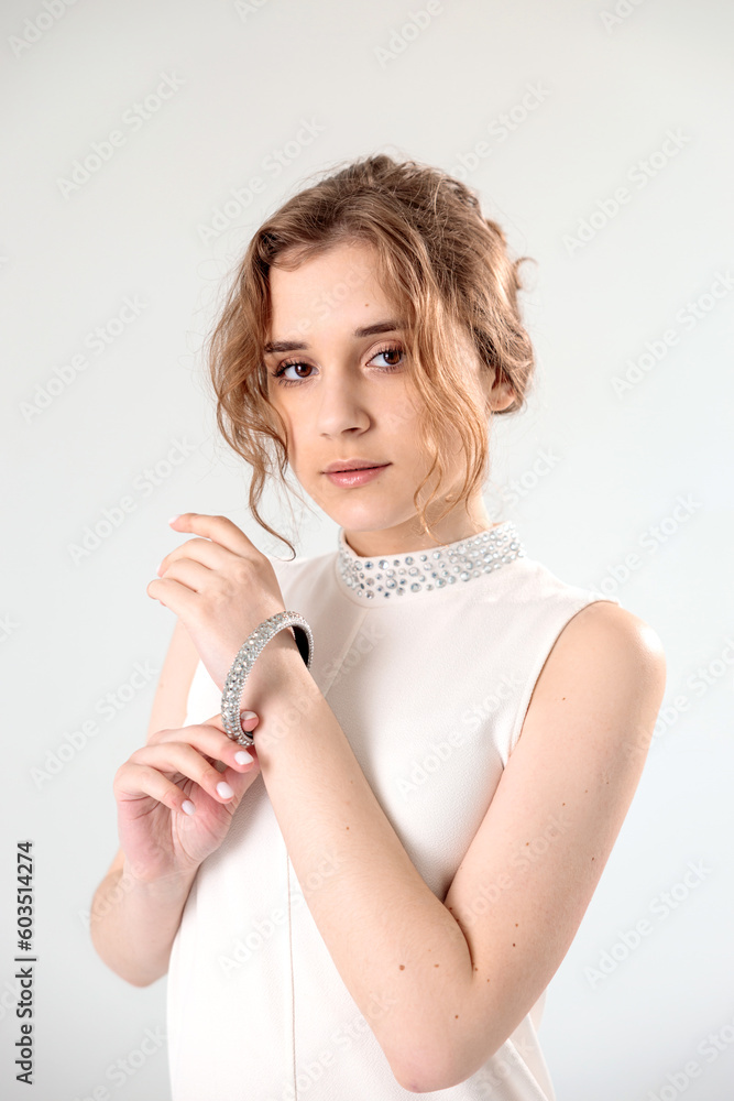 young girl in a white dress on a white background young girl in a white dress on a white background