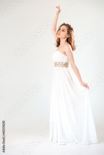 young girl in a white dress on a white background
