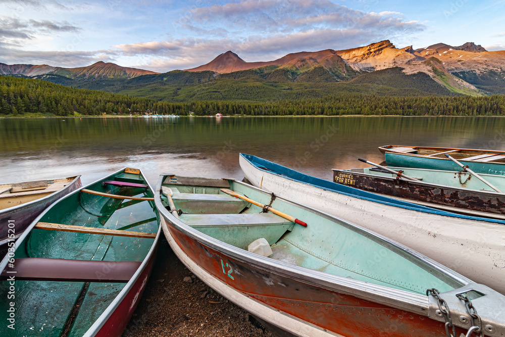 The day is coming to an end, the canoes have returned and the evening is getting ready on the shores of the lake. Maligne Lake - Jasper National Park is a national park in Alberta, Canada. It is the l