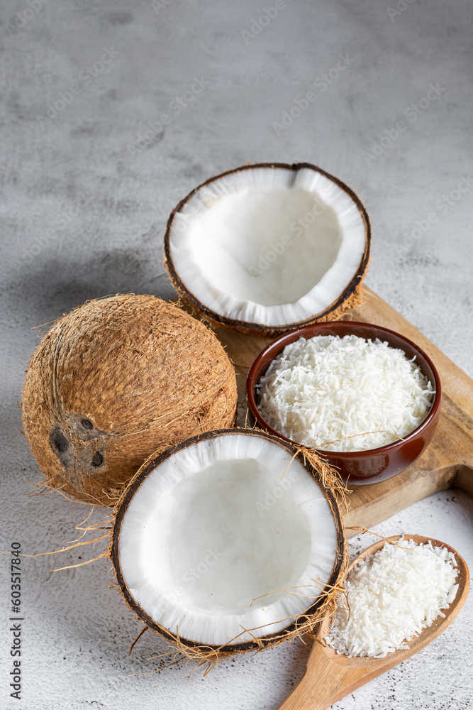 Whole coconut, pieces of coconut and shredded coconut on the table. Whole coconut, pieces of coconut and shredded coconut on the table.
