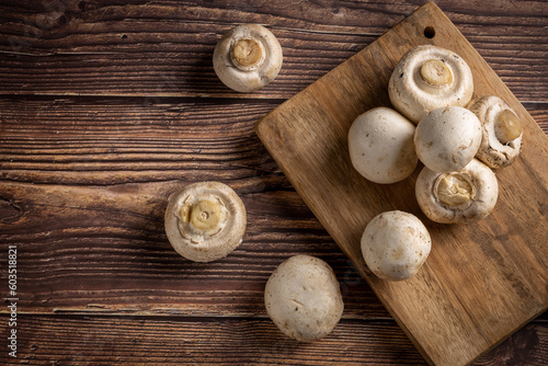 Fresh white mushrooms on the table.