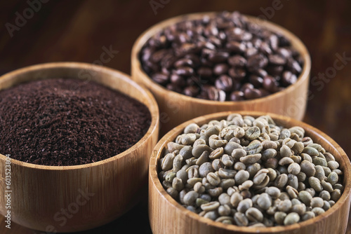 three types of coffee bean in a wooden bowl