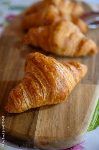 Fresh baked buttered croissants served in restaurant for continental or French breakfast